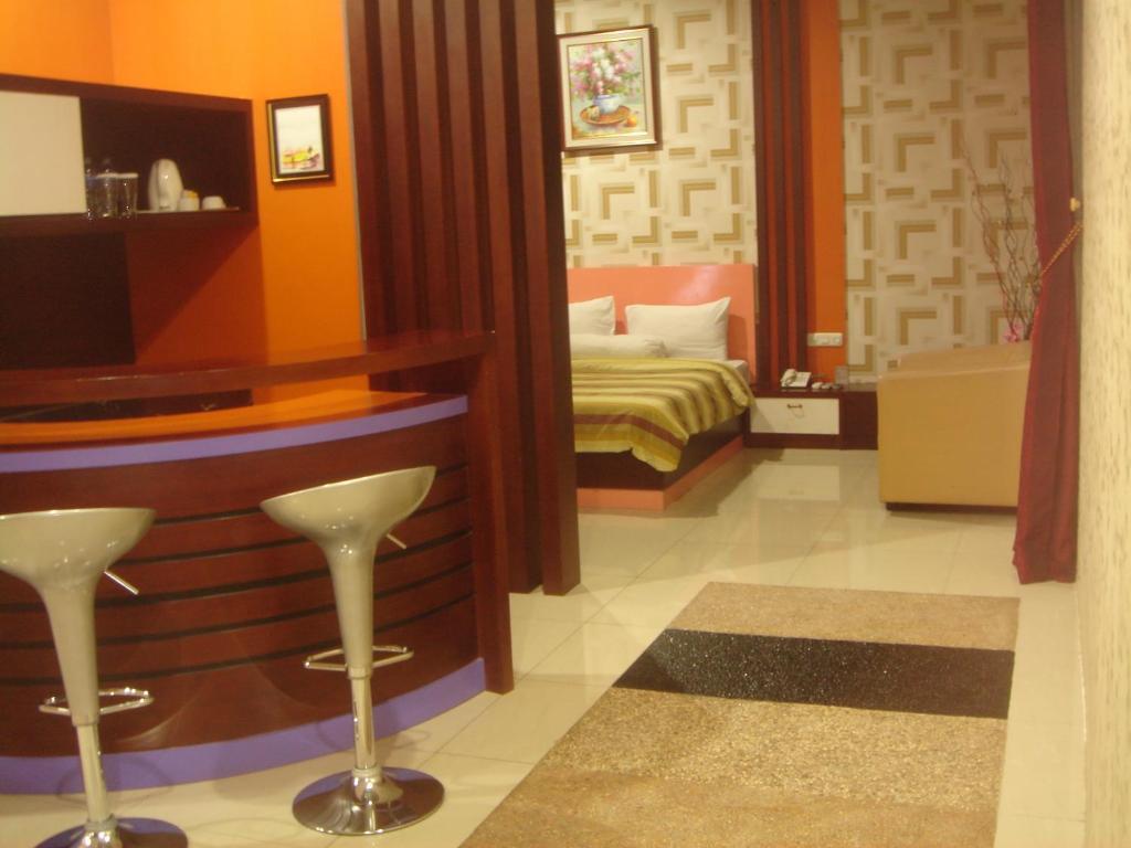 Golden Harvest Hotel Jambi Quarto foto