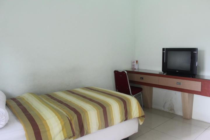 Golden Harvest Hotel Jambi Quarto foto