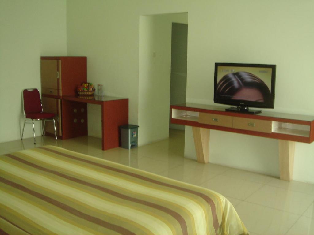 Golden Harvest Hotel Jambi Quarto foto